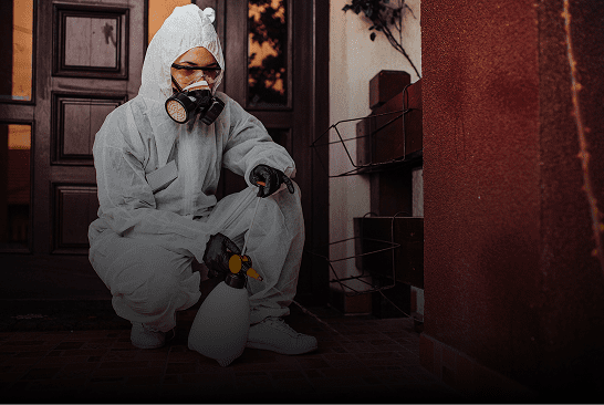 Individual wearing hazmat suit outside